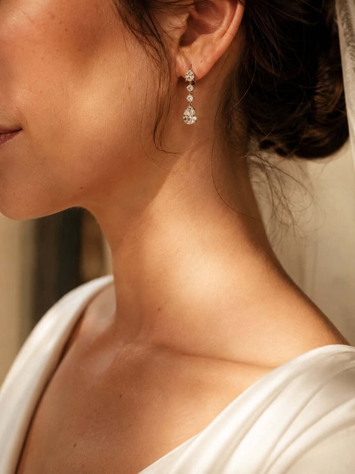 Bride wearing elegant diamond earrings