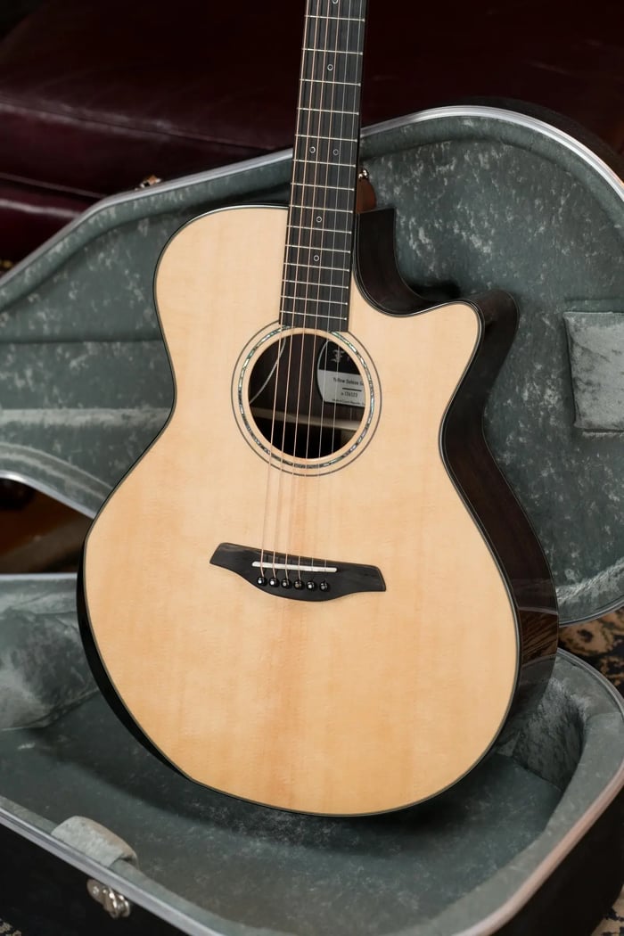 Furch Furch Yellow DLX Gc-SR: Full Specs & Details Solid Top - Grade: Sitka Spruce (AA) Solid Back & Sides - Grade: Indian Rosewood (AA) Binding:  Black and white line Bridge: Ebony Bridge Pins: Faux tortoise Saddle: TUSQ, Fully Compensated Top Finish: Full-Pore High-Gloss Finish  Back & Sides Finish: Full-Pore High-Gloss Finish Nut Width: 1 3/4” Neck Reinforcement: Carbon Reinforced Truss Rod with Two-Way Adjustment Neck Profile: Furch Soft V Fretboard Material: Ebony Fretboard Side Inlay: Pearl linear position markers Fret Finish: Polished Headstock Overlay: Ebony Neck Material: African Mahogany Machine Heads: Gotoh 510 Silver Patina - gear ratio 1:21 Strings: D'Addario XSAPB1253 Neck Finish: Full-Pore Smooth-Slide Satin Finish with Antibacterial Additive Headstock Finish: Full-Pore High-Gloss Finish Case: Hiscox hard shell case