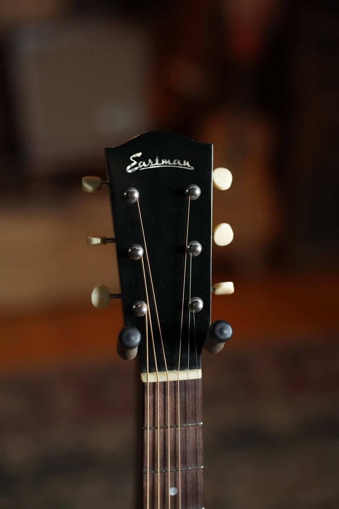 Eastman E15 headstock with gold Eastman logo, vintage-style tuners and cream buttons