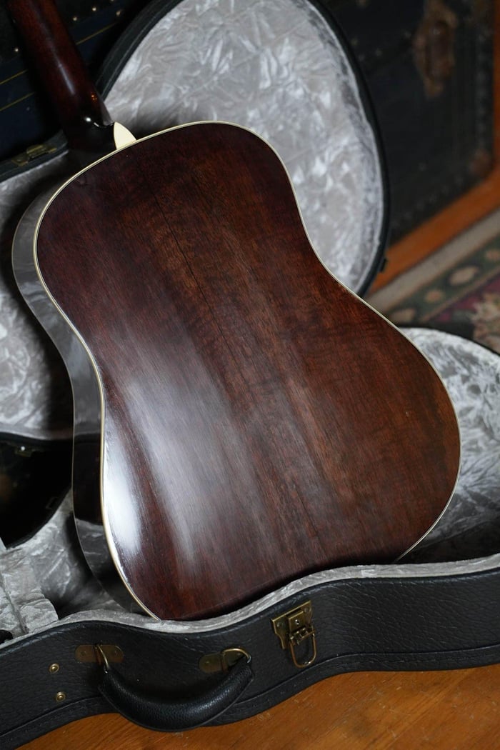 Solid mahogany back of the Eastman E15SS/V-SB with cream binding, resting in its case