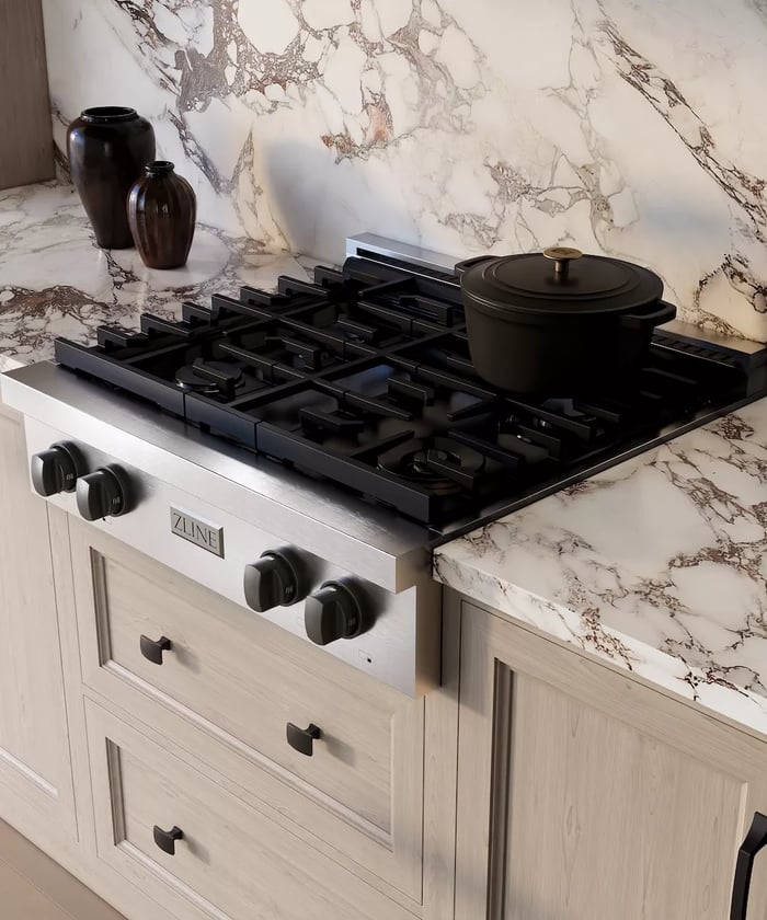 Cooktops vs. Rangetops: Compact rangetop with a black pot on cooking surface.