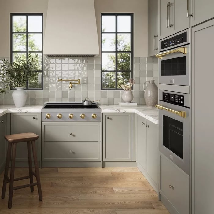 Cooktops vs. Rangetops: Induction rangetop with large range hood.