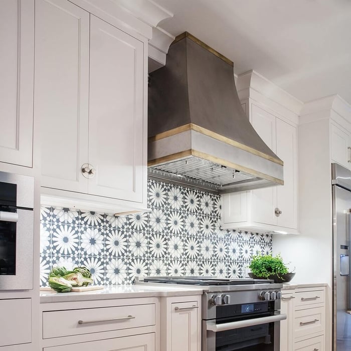 Custom Curved European Range Hood in a cottage-style kitchen