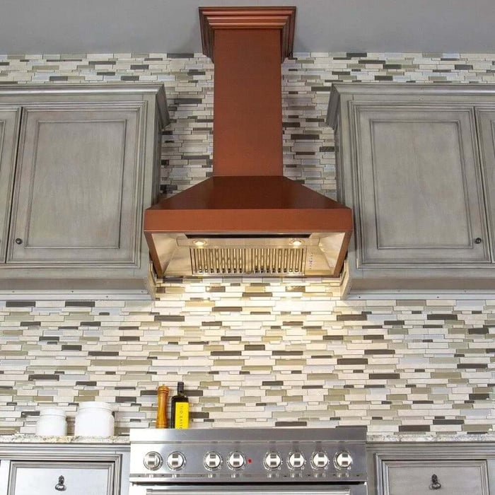 ZLINE Convertible Designer Series Copper Wall Mount Range Hood (8667C) in a rustic kitchen