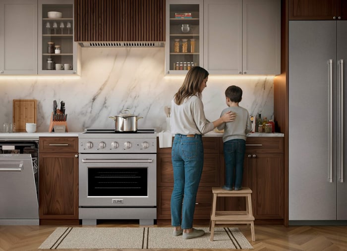 A woman and a child in a kitchen with matching appliances.