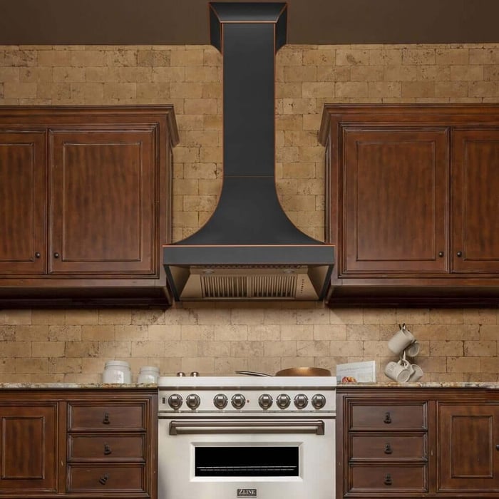 Oil-rubbed bronze range hood in an old-world rustic style kitchen