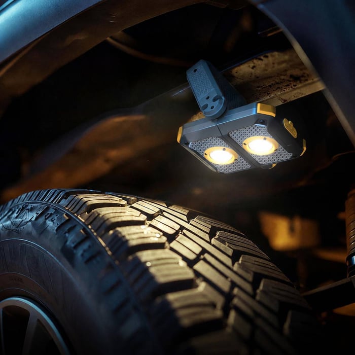 HOKOLITE ADELANTE W3 work light illuminating a vehicle wheel area