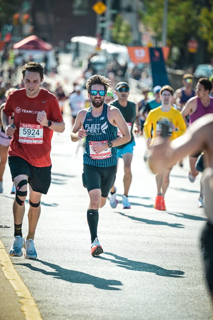 Runner wearing a calf compression sleeve for running during training