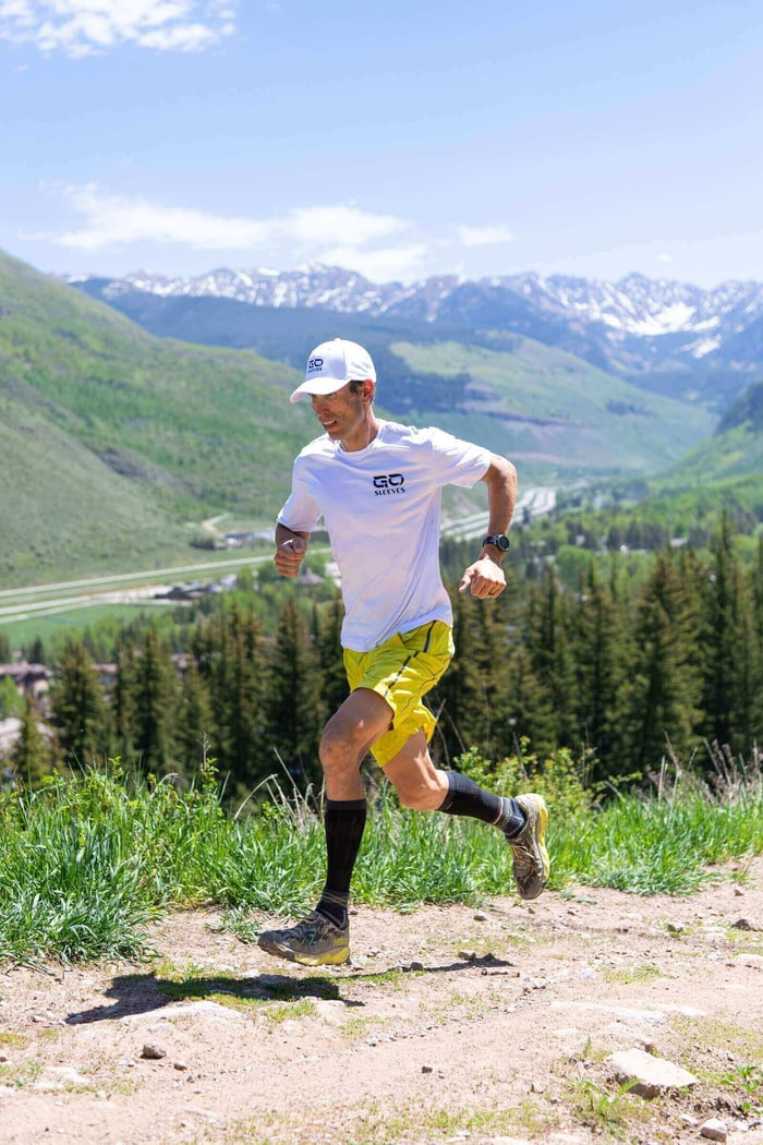 Runner wearing GO calf sleeves — a key tool for how to prevent shin splints.