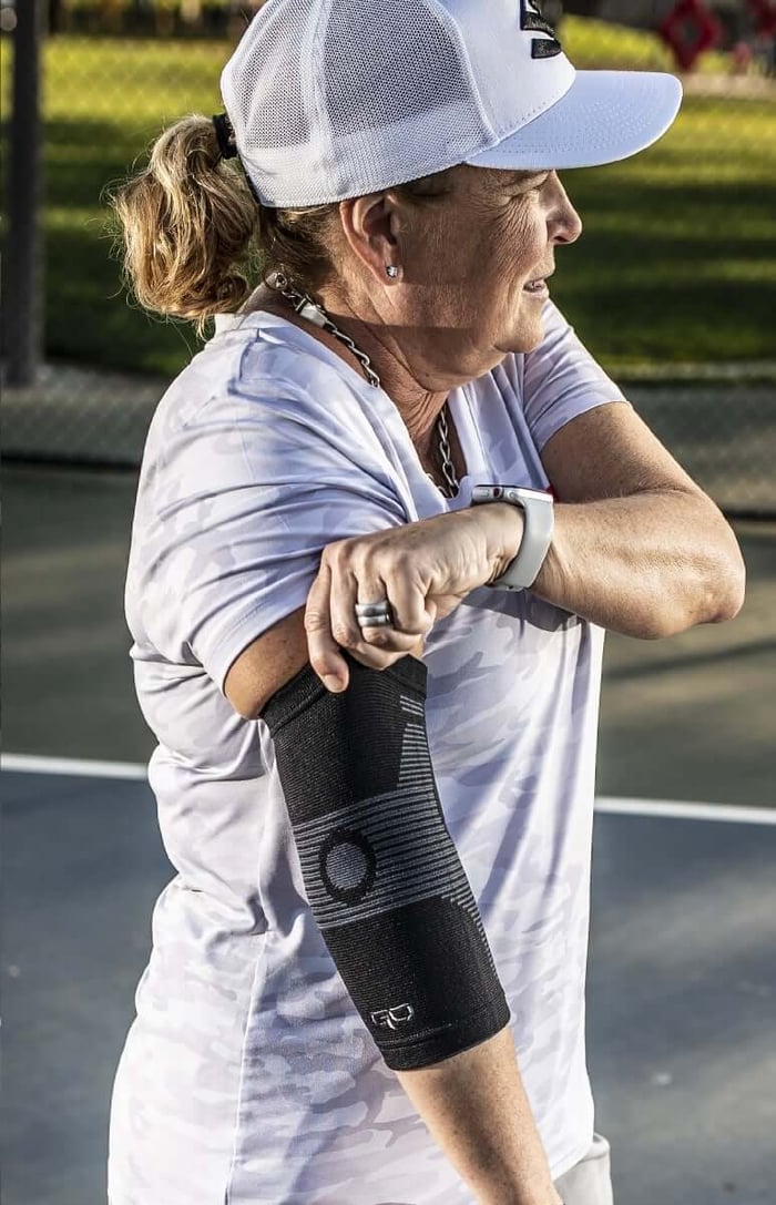 GO Sleeves partner Vicki Sciacqua wearing an elbow sleeve that supports movement and recovery as part of elbow bursitis treatment.