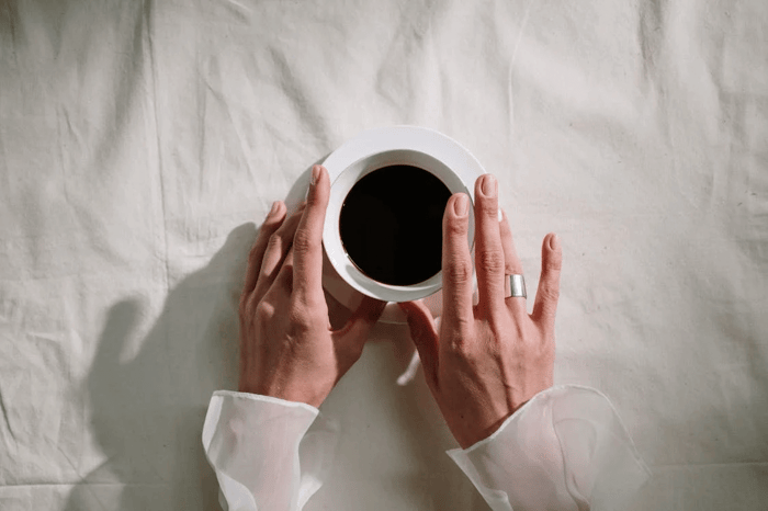  person holding cup of coffee