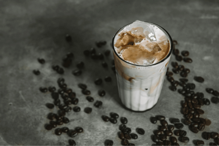 creamy iced coffee on a drinking glass
