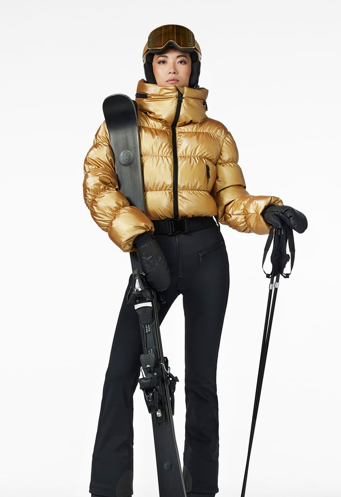 The Ultimate Guide to Choosing the Best Women's Ski Gloves and Mittens for Warmth and Style - lady in grey jacket