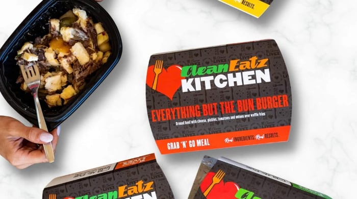 Healthy meals for weight loss featuring a Clean Eatz “Everything But the Bun Burger” prepared meal with diced toppings and waffle fries in a container.