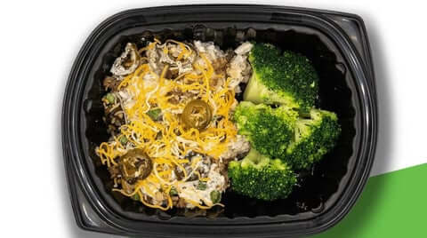 Best high protein meal keto jalapeno chicken with melted cheese, sliced jalapenos, and broccoli florets in meal tray.