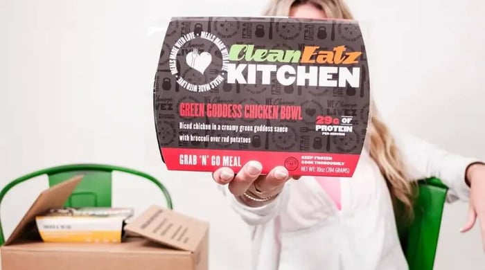Calories and portions in meal plans highlighted on Clean Eatz Kitchen Green Goddess Chicken Bowl packaging with protein and serving information.