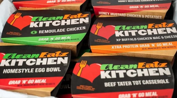 Fitness meal plans displayed as Clean Eatz Kitchen grab-and-go packaged prepared meals.