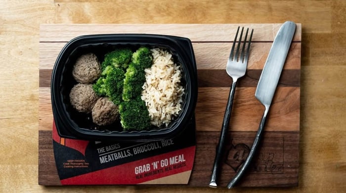 Gluten-free meal delivery kits with meatballs, broccoli, and rice in a packaged grab-and-go meal.