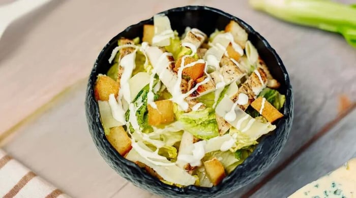 Healthy meals featuring an Asian chicken slaw salad with shredded cabbage, carrots, red pepper, cilantro, and lime.