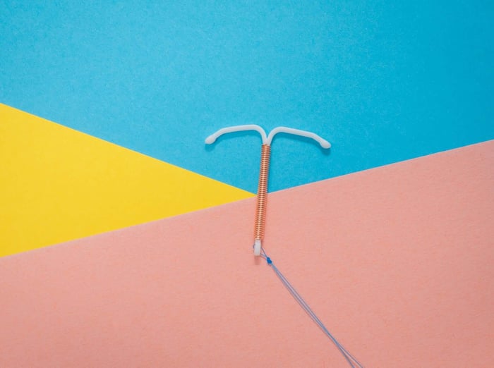 ntrauterine device on colorful surface.