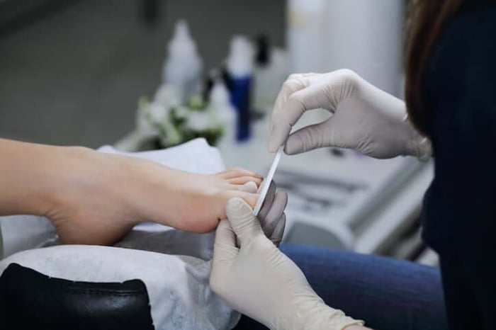 File nails straight across