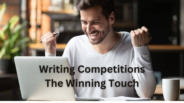 Writing Competitions - The Winning touch - Man celebrating with raised hands at a laptop