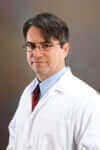 Dr. Hector Valenzuela, Chief Science Officer reviewing TA-65 research data