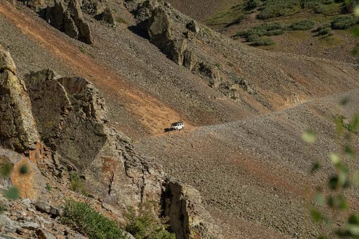 Driving across Ophir Pass in our overland-ready Ineos Grenadier.