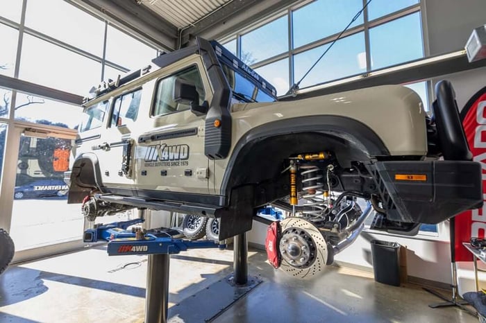 Our overland-ready Ineos Grenadier sitting on the rack after our suspension upgrade.