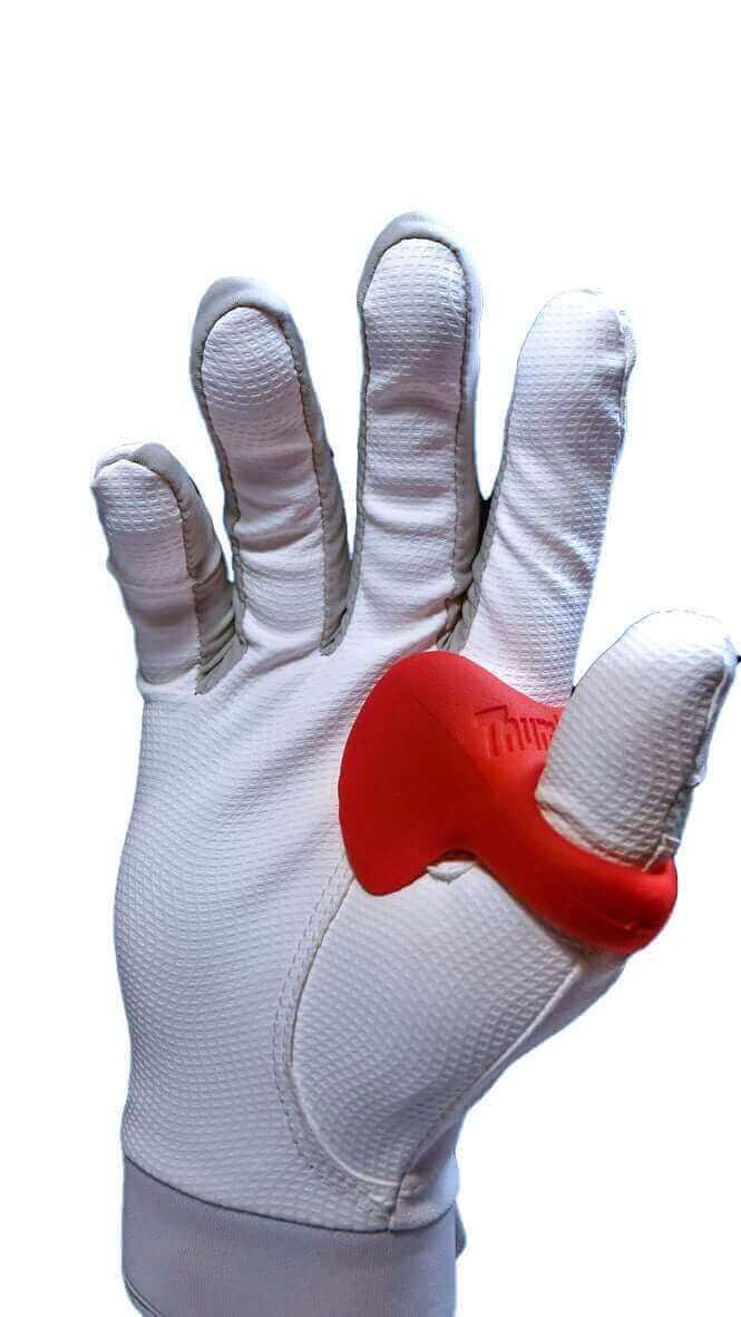 A white padded batting glove with a red protective baseball thumb pad covering the thumb joint, shown against a plain white background.