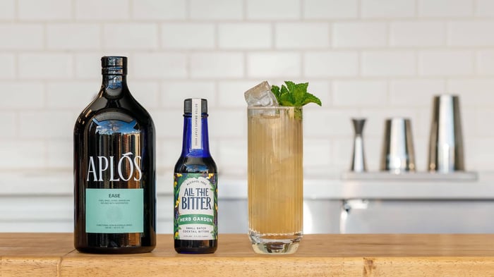 Non-Alcoholic Tom Collins mocktails made with Aplos Ease and herbal bitters.