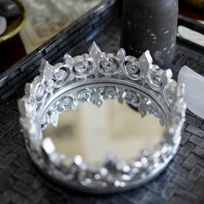 Victoria Aveyard Red Queen Crown Mirror Tray featuring a gold crown studded with jewels and a mirrored bottom