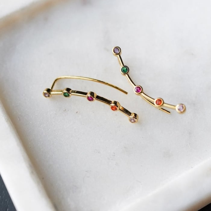 Red Queen Mare Barrow Crawler Earrings are gold with 5 rhinestones in pink, red, purple, green, and blood red.