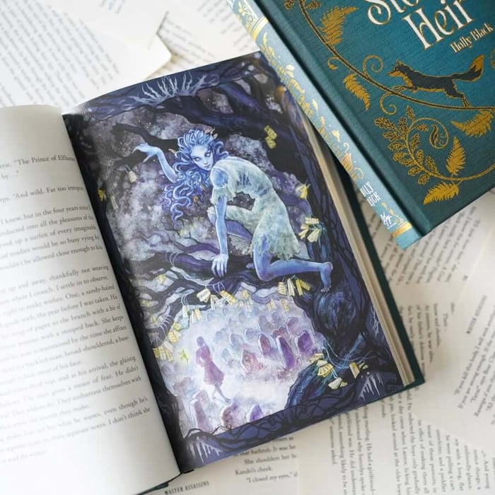 This image shows an open book with a fantastical illustration on the right page depicting a figure with long hair sitting on a tree branch. The left page contains text with a narrative style. The book is placed on top of other open pages from different books, suggesting a reading or study environment. The visible book spine in the top right corner has decorative elements and text, including the name "Holly Black," indicating the author. The overall scene suggests an interest in fantasy literature.