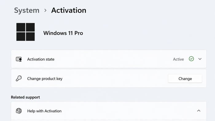 Windows 11 Settings showing System > Activation with the option to change product key