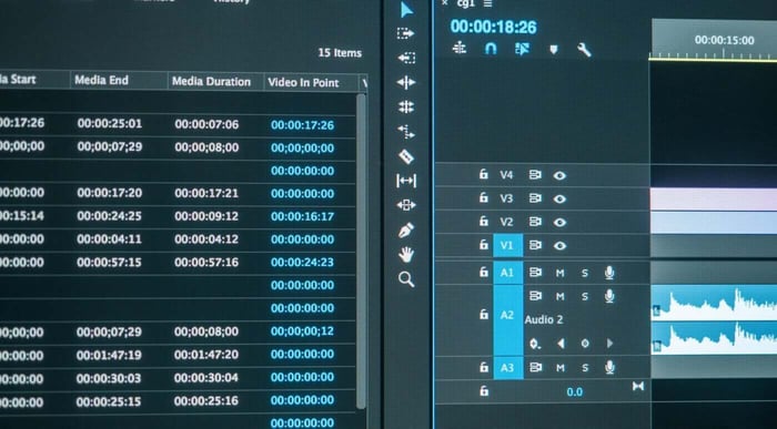 Video editing timeline with audio tracks, representing review of surrounding context during redaction