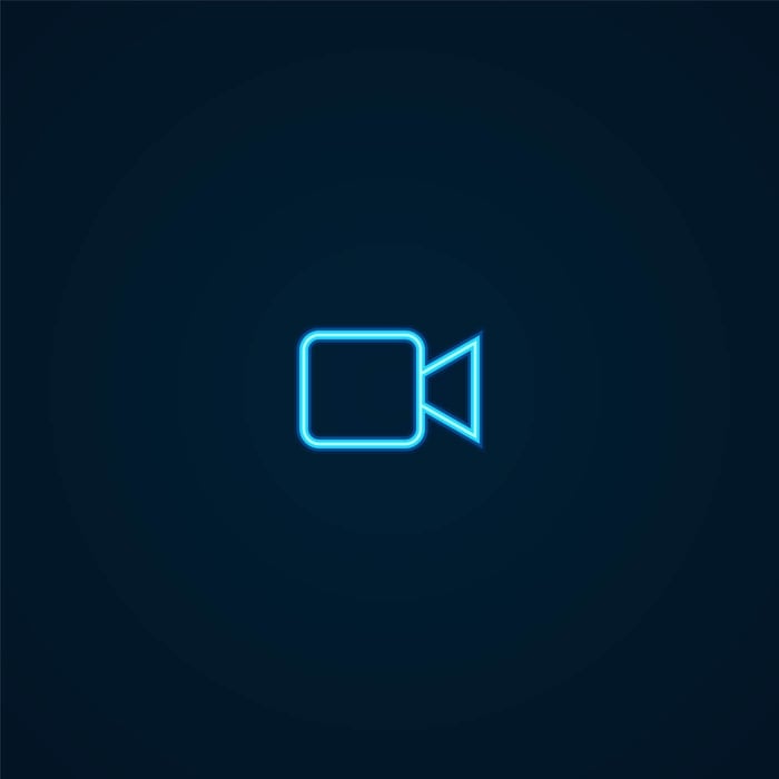 Glowing video camera icon on a dark background, representing video authentication and evidence integrity