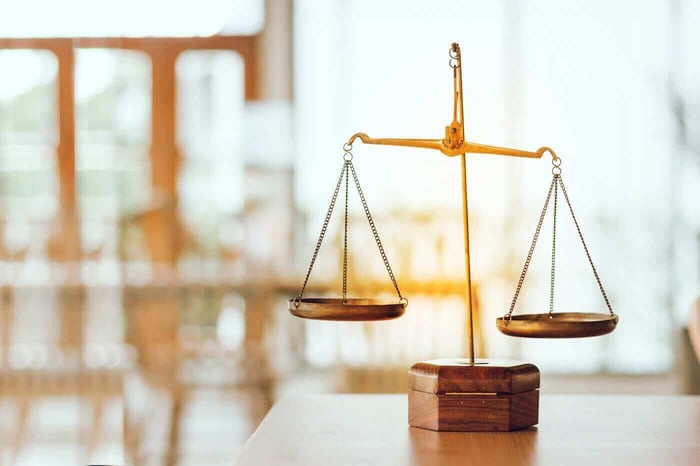 Brass scales of justice, representing balanced and defensible forensic support for attorneys