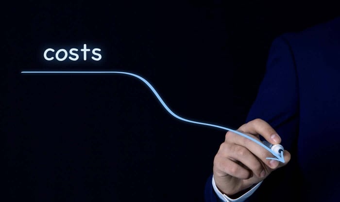 Hand drawing a downward cost curve, representing the savings from outsourcing video redaction