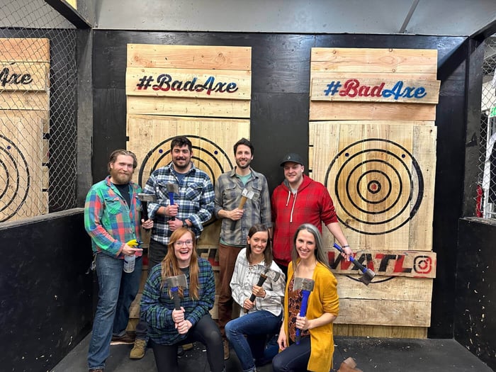 Group photo of the Focal Forensics team in front of the axe throwing targets