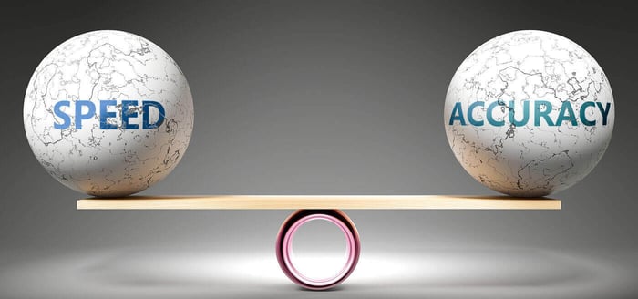 Spheres labeled speed and accuracy balanced on a beam, representing the tradeoff in redaction turnaround