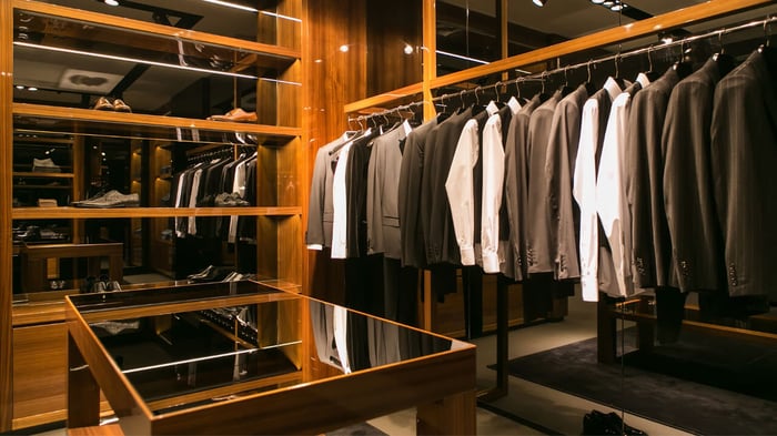 A closet showcasing suits and personal style