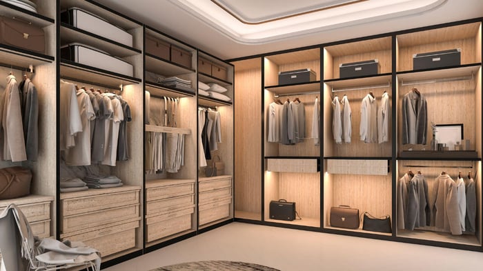 curated walk-in closet with tuxedo jackets and satin stripe for formal events