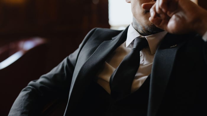 man in a suit and black tie