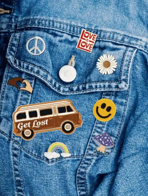 Hippie/Traveler/Retro Patches and Pins collage on a jean jacket