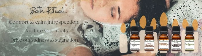 Woman soaking in bath tub peacefully, with images of candles and amber bottles of pure essential oils by Miracle Botanicals, text reads “Bath Ritual… Comfort & calm introspection. Nurture your roots. Drive out sadness & stagnation."