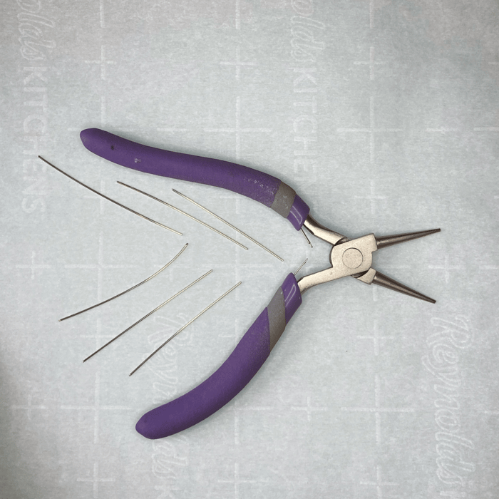Needle nosed pliers and short lengths of 21g wire