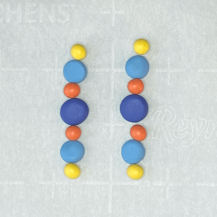 Polymer clay beads lined up in earring order