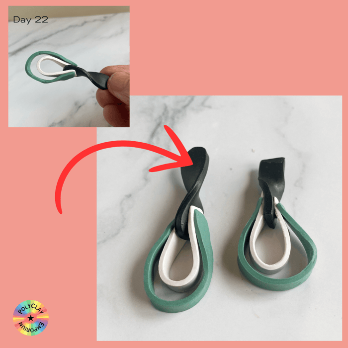 Green white and black polymer clay ribbons twisted into teardrop shapes.