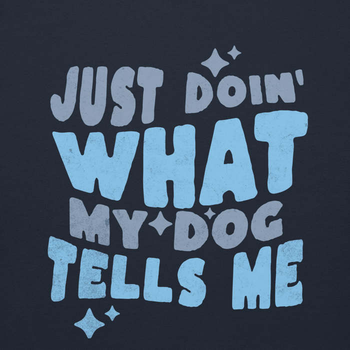 “Just Doin’ What My Dog Tells Me” graphic lettering with star accents printed on dark navy fabric.